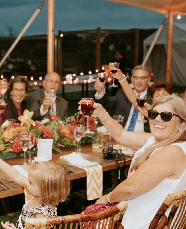 group of people eating a meal at a table